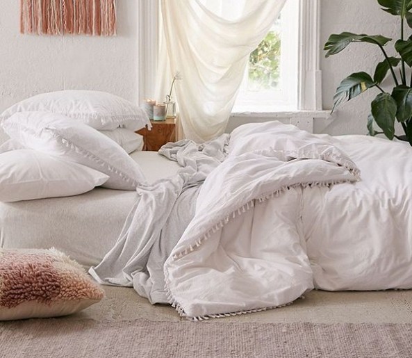 white-tassel-divet-cover-urban-outfitters-e1530809947237.jpg